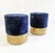 These particular poufs are handmade in Italy and upholstered with a paisley printed blue velvet and have a finishing rim...