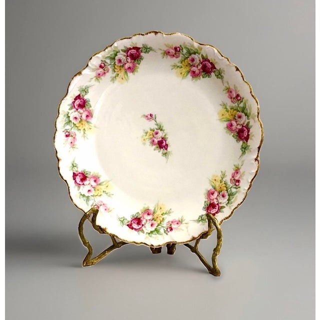 A beautiful antique Elite Works Limoges charger, dating from 1896–1920, featuring hand‑painted rose sprays in soft pinks...