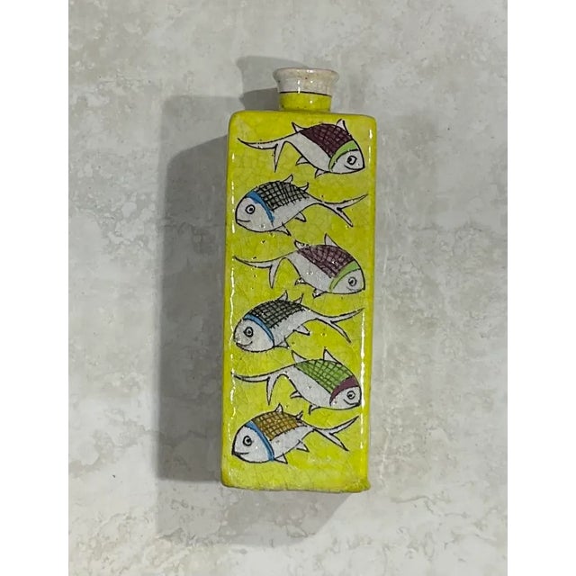 Beautiful Persian ceramic vase hand-painted and glazed with colorful fish motif surrounding on green color background....