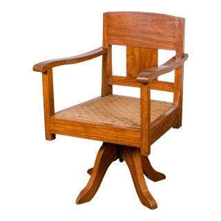 Midcentury Wooden Swivel Chair with Woven Rattan Seat and Quadripod Base For Sale