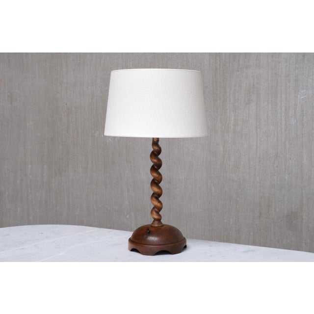 This striking, generously sized table lamp was produced in France in the 1950s. The sculptural design consists of a hand-...