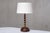 This striking, generously sized table lamp was produced in France in the 1950s. The sculptural design consists of a hand-...