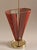 A very unusual umbrella stand in the shape of a half-open umbrella. The design with the red perforated metal is...