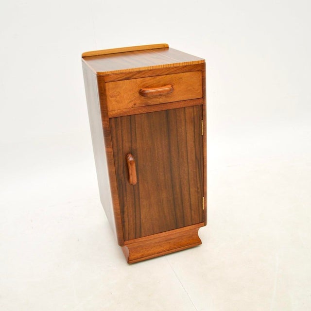 A stunning Art Deco figured walnut bedside cabinet. This was made in England, it dates from around the 1930’s. The quality...