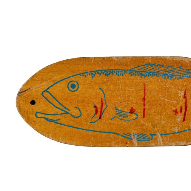 Vintage fish-shaped wooden filleting board with metal clamp, a charming piece of mid-20th-century coastal folk art and...