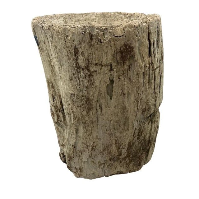 The antique wooden Ukhali from India is a culturally significant mortar crafted from seasoned hardwood. Adorned with...