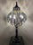 A striking and highly sculptural monumental vintage table lamp, this piece captures the opulence of Hollywood Regency...