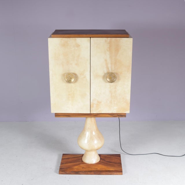 Designed by the renowned Italian designer Aldo Tura, this exceptional bar cabinet from the 1950s is a true statement of...
