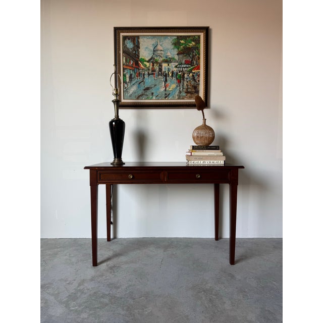 Elegant and timeless, this French Grange writing desk is crafted in the refined Louis XVI style, showcasing clean...