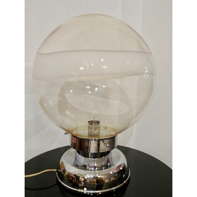 Hand blown Murano glass sphere on chrome base by Carlo Nason. Made in Italy, Space Age in the 1960s. The hand blown glass...