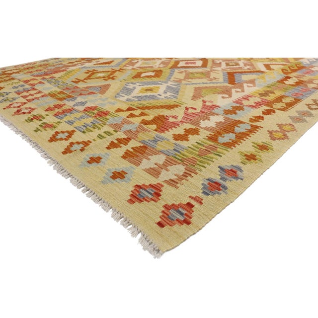 ​80132 Vintage Afghani Kilim Rug, 06’10 x 09’09. Full of tiny details and nomadic charm, this handwoven wool vintage...