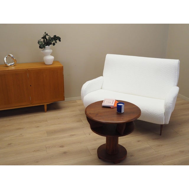 The coffee table was made in the 1960s, Italian production. The structure and the top are made of solid oak wood. The...