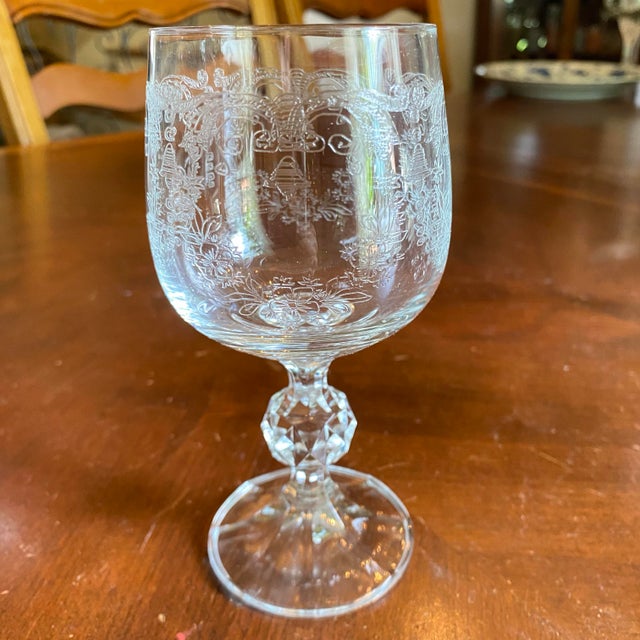 Bohemia Cascade Fine lead crystal with etched floral or heart designs on the bowl and a faceted ball stem. Made in...
