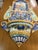 A hand-painted ceramic wall fountain or plate, harking back to the artisanal tradition of Campanian or Vietri ceramics,...