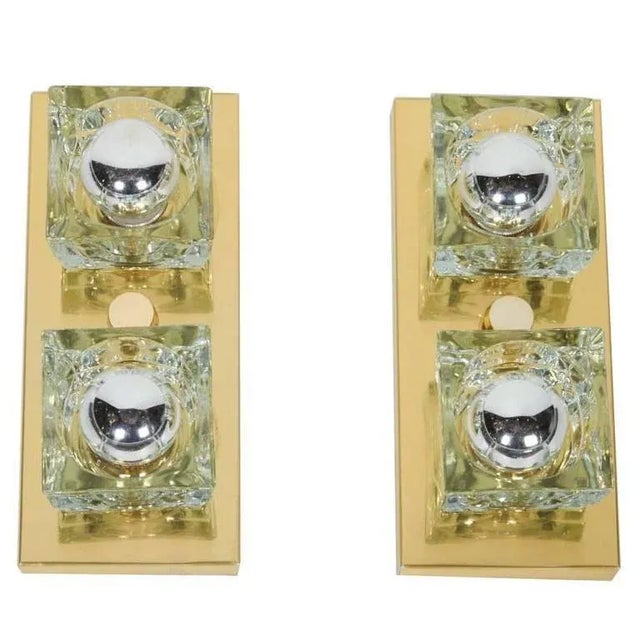 Cubist Mid-Century Modern wall sconces featuring two handcut glass shades each in block forms. Frames are wall-mounted...