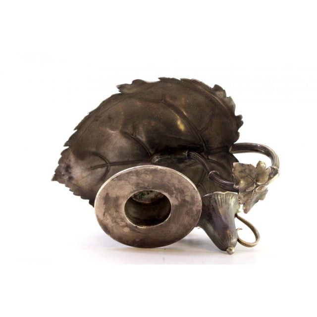 Silver Paddle with Reliefs and Leaf-Shaped Cut Out Base, in Very Good conditions. Designed from 2000 This piece has an...