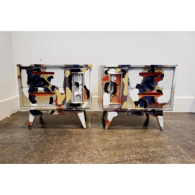 All-over abstract composition hand-painted in acrylic and spray-paint by artist Lionel Lamy on a pair of 1960's...