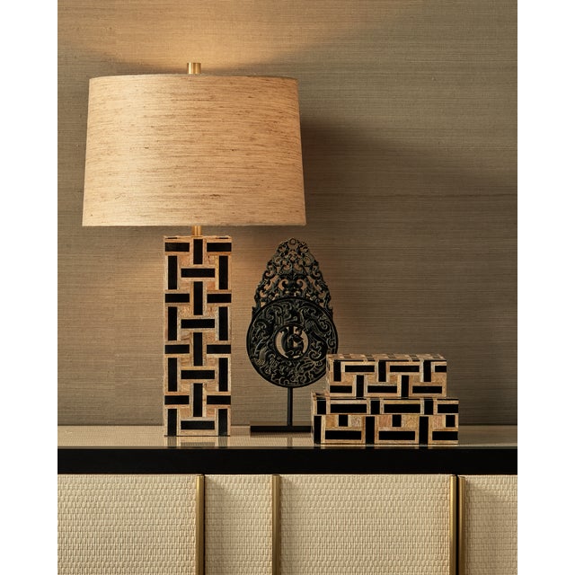 The Aarna Black Box Set with its basket-weave pattern is made of pieces of wood interspersed with strips of black...