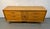 Striking mid-century modern lowboy dresser with iconic sculpted drawer pulls and tapered legs. Features six spacious...