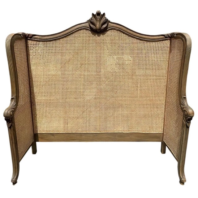The French Regency Queen Headboard features a double-hole cane design with natural rattan and brown mahogany wood in an...