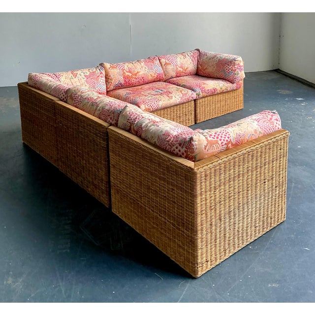 This vintage woven rattan sectional sofa captures the timeless appeal of mid-century wicker craftsmanship with a relaxed...