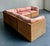 This vintage woven rattan sectional sofa captures the timeless appeal of mid-century wicker craftsmanship with a relaxed...