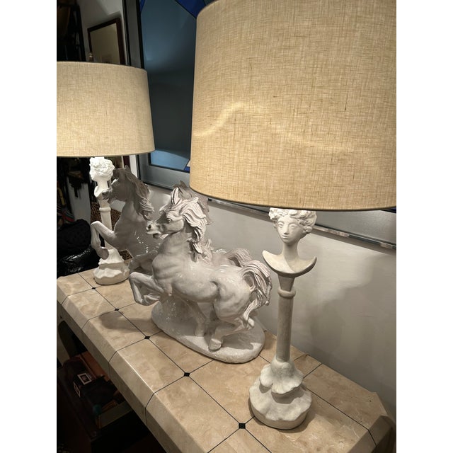 Timeless pair of painted white plaster table lamps after the original by Alberto Giacometti. Tete de Femme was designed...
