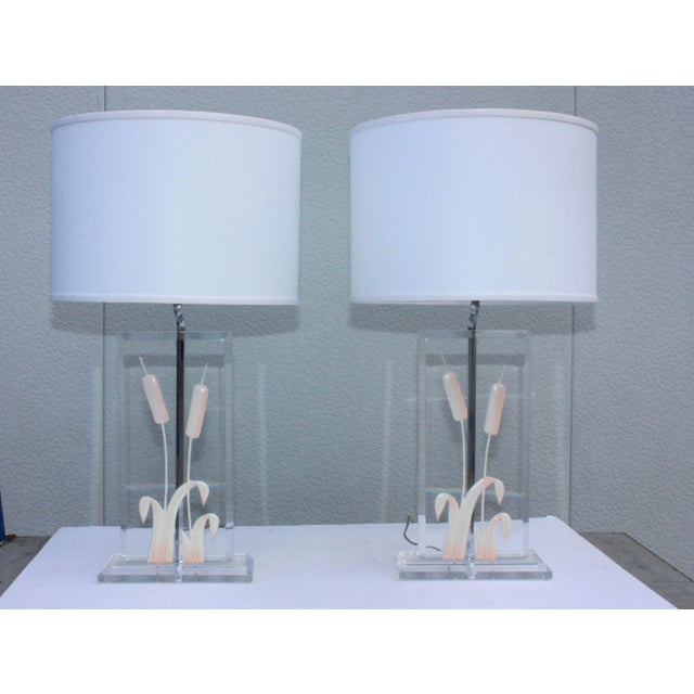 1970s modern Italian Lucite table lamps. With cattail detail and chrome hardware. Shades for photography only.