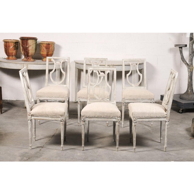 Elegant and timeless, this set of six 19th-century lyre-back chairs showcases the refined neoclassical design that has...