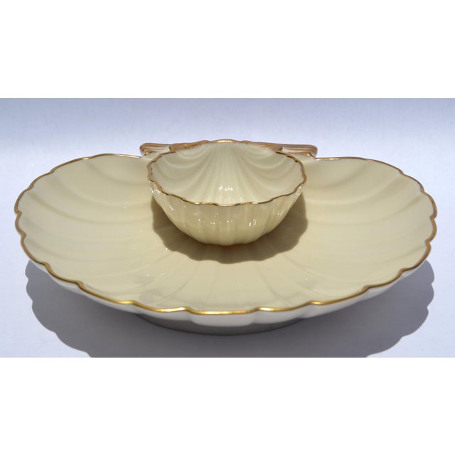 For Sale the Lenox Aegean Shell Chip & Dip Medium Serving Dish crafted from ivory-toned porcelain with gold trim and a...