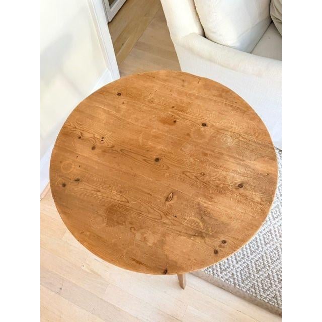 Antique Cricket Table Charming antique pine cricket table featuring a round top, three splayed legs, and a distinctive...
