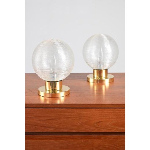 Set Doria Leuchten lamps with heavy gold colored base. The glass bulbs are covered with thin glass threads. This set has...