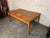 This striking Danish modern dining table features two stowaway leaves, making the table 111.5" wide when fully extended...