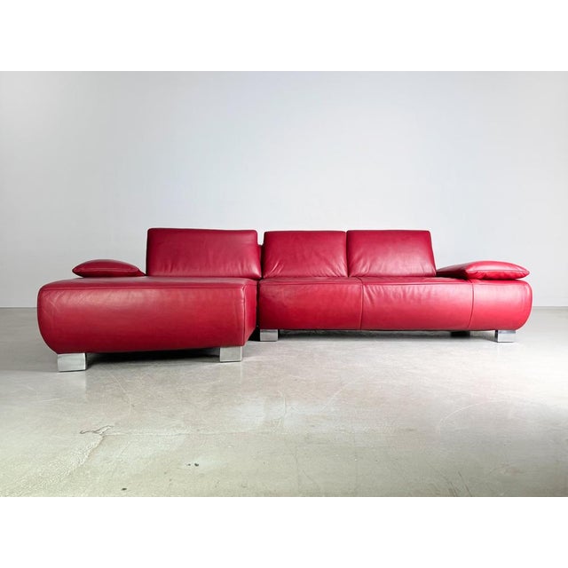 Beautiful red corner leather sofa from Koinor (model: Volare). The sofa has adjustable armrests and offers enough space...