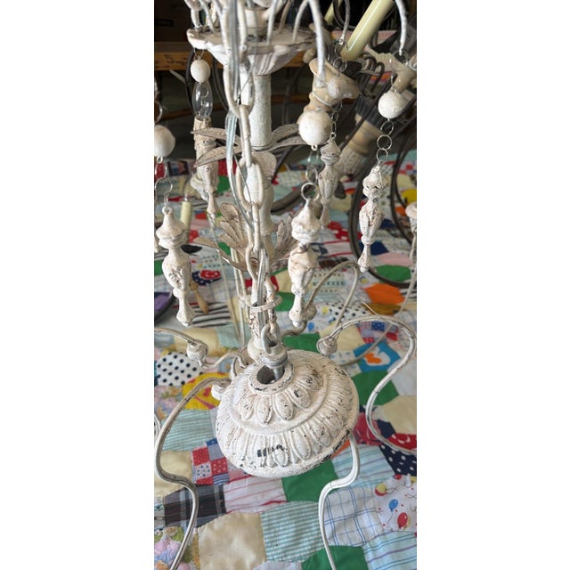 Graceful and airy, this French Provincial-inspired chandelier blends elegant ironwork with delicate crystal detailing to...