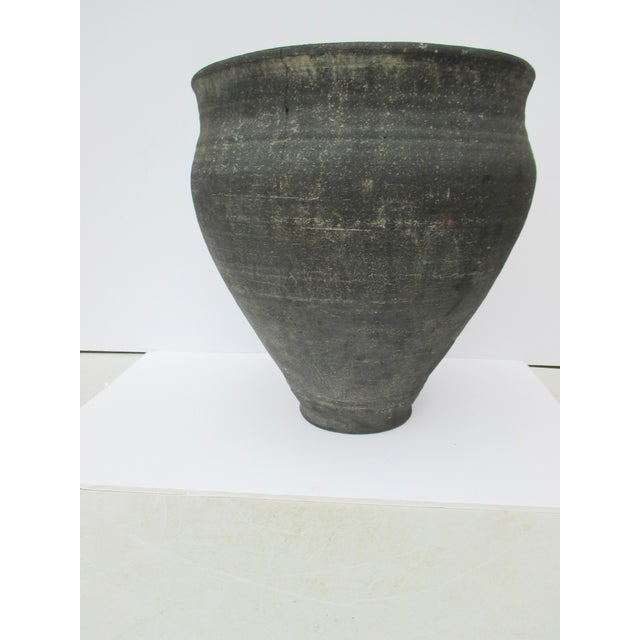 terra cotta terra cotta handmade jar. Carbonized clay with a dep carbon finish on the clay body. Handthrown in Egypt circa...