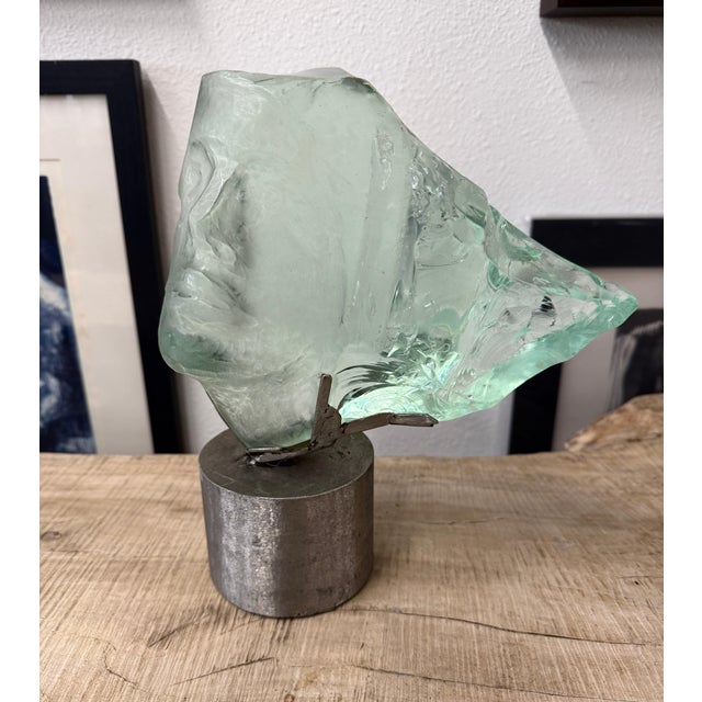 A stunning green slag glass sculpture by the noted artist Suzanne Regan Pascal. It is mounted on a steel base and measures...