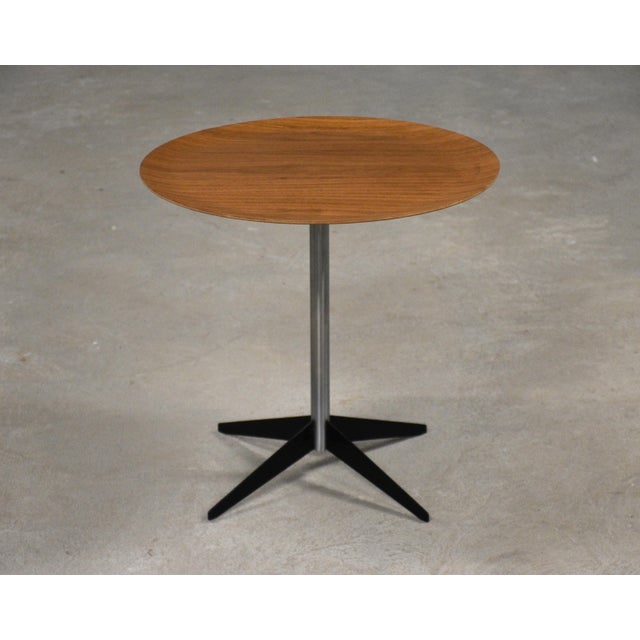 A mid century modern rare tray side table end table constructed of enameled steel, chromed steel, and a thin teak round...