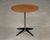 A mid century modern rare tray side table end table constructed of enameled steel, chromed steel, and a thin teak round...