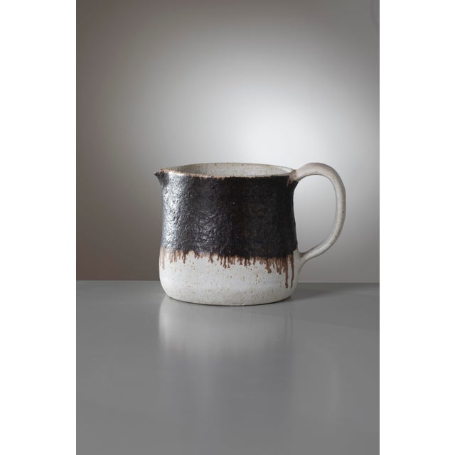An exceptional studio pottery pitcher, designed and handcrafted by the renowned Italian ceramicist Bruno Gambone in...