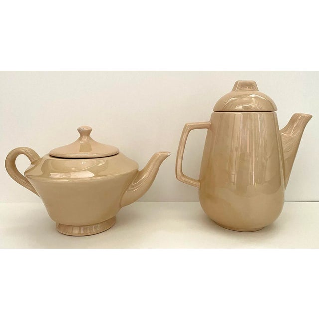 Vintage set of ceramic Tea & Coffee pots US made by Holiday Designs. Each creamy beige pot with removable lids have...