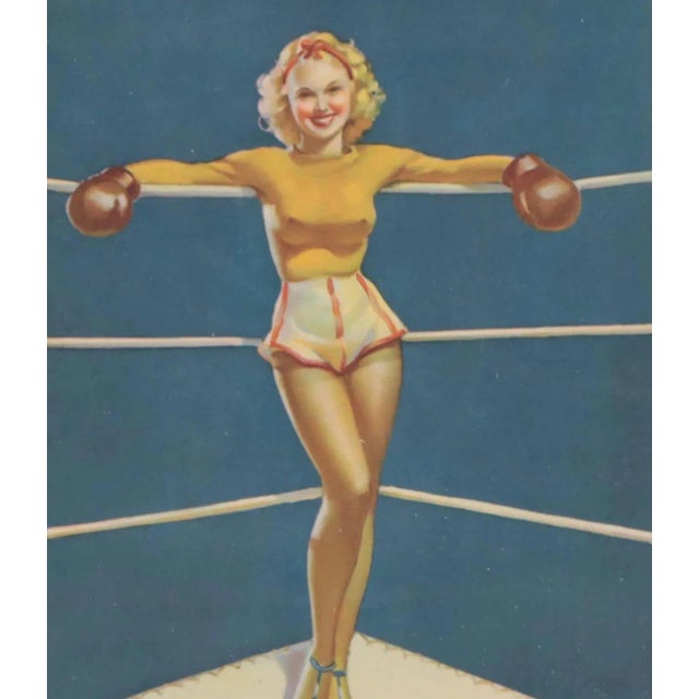 Black lacquered wood framed offset lithograph after Gil Elvgren, titled “A Knock Outgg”. Image site measurements, 7.5” x...