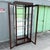 Vintage Campaign-Style Wood and Brass Lighted Curio Display Cabinet For Sale In West Palm - Image 6 of 10