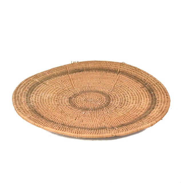 Handwoven Makenge flat wedding basket handmade by the Mbundu women within Zambia. These baskets are traditionally made...