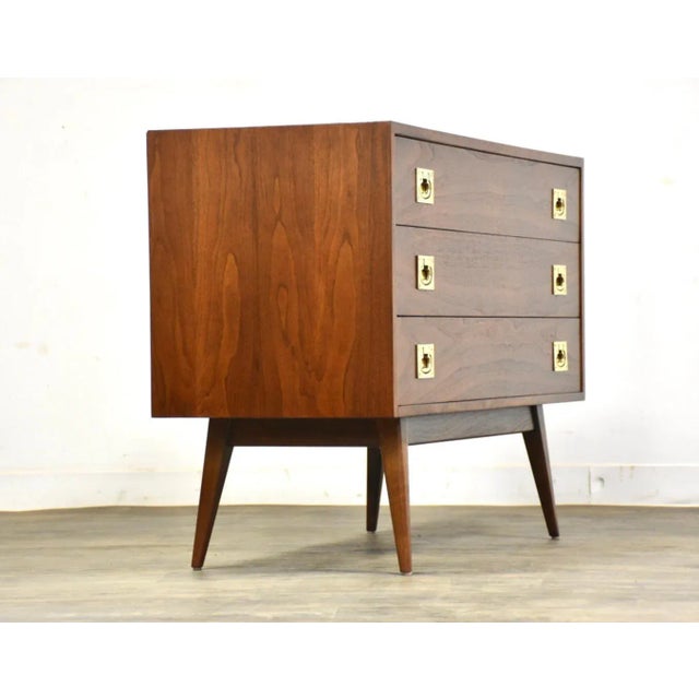 A mid century modern walnut extremely rare three drawer dresser by Martin Freedgood. Polished brass drawer pulls. Superb...