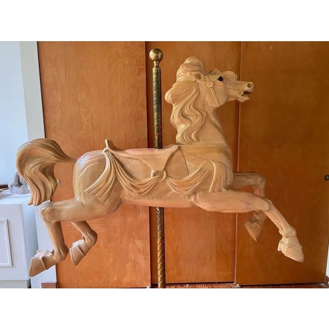 This custom carousel horse was created in approximately 1986 by Tony Trezza. Horse is supported by brass pole with finial...