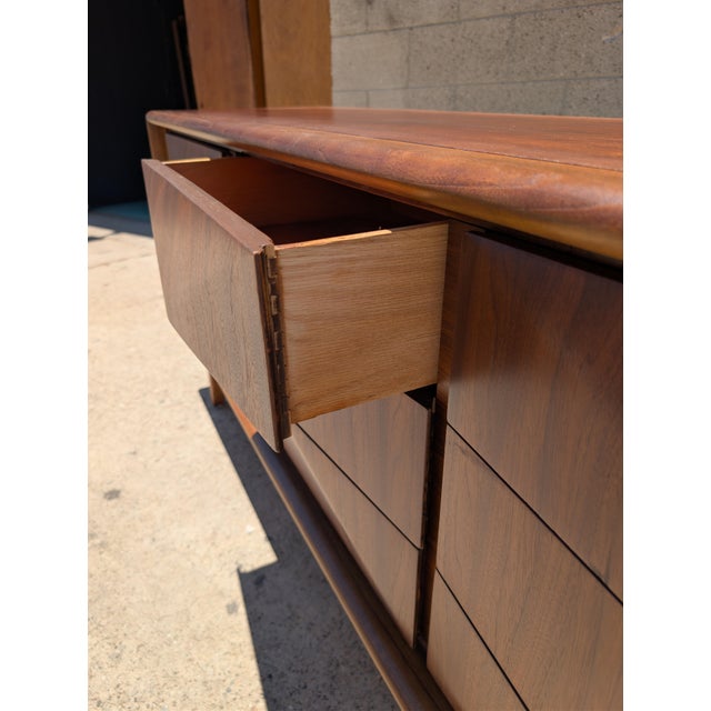 Elevate any space with this iconic mid-century American modern design! This classic, diamond-sculpted low boy dresser...