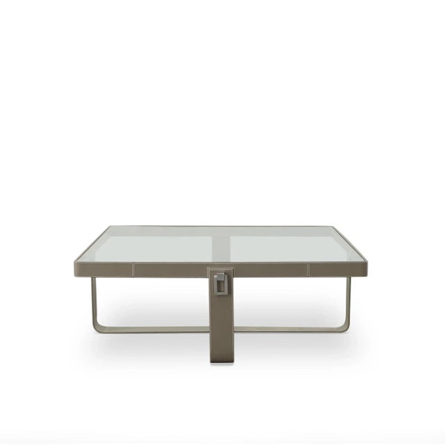 Glass top on dove grey leather wrapped base with polished nickel hardware Assembly Required? No Care Instructions: Dust...