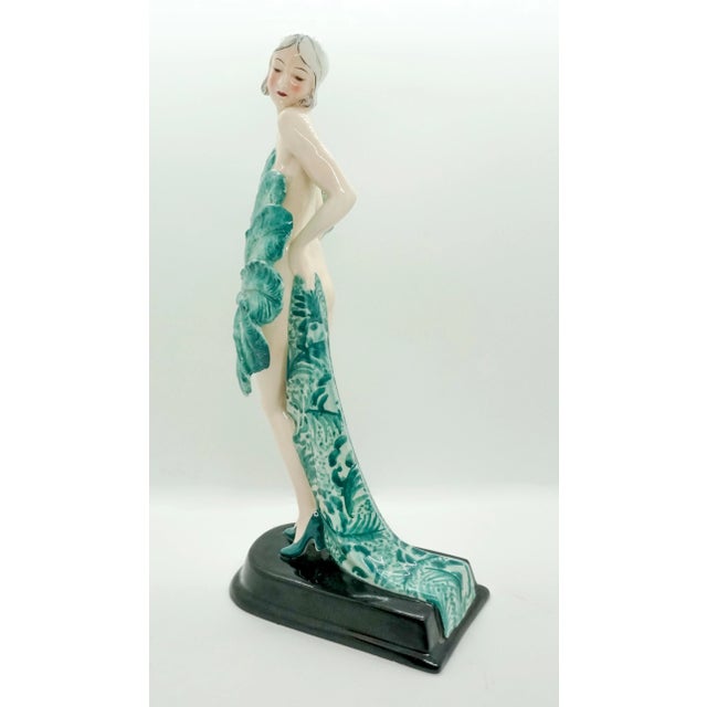 Rare goldscheider ceramics of the 1930s the standing young variety dancer is only dressed in high heels. Looking to the...