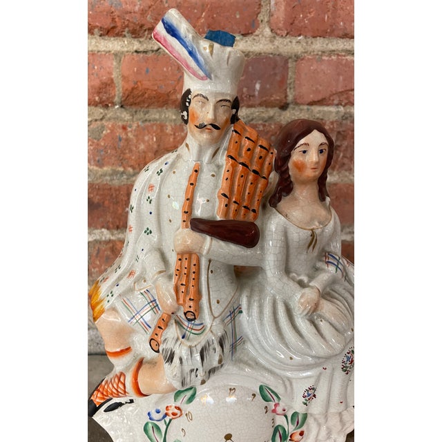 This is a delightful Staffordshire man and woman. They add such a nice touch to any table top or display case. A true...